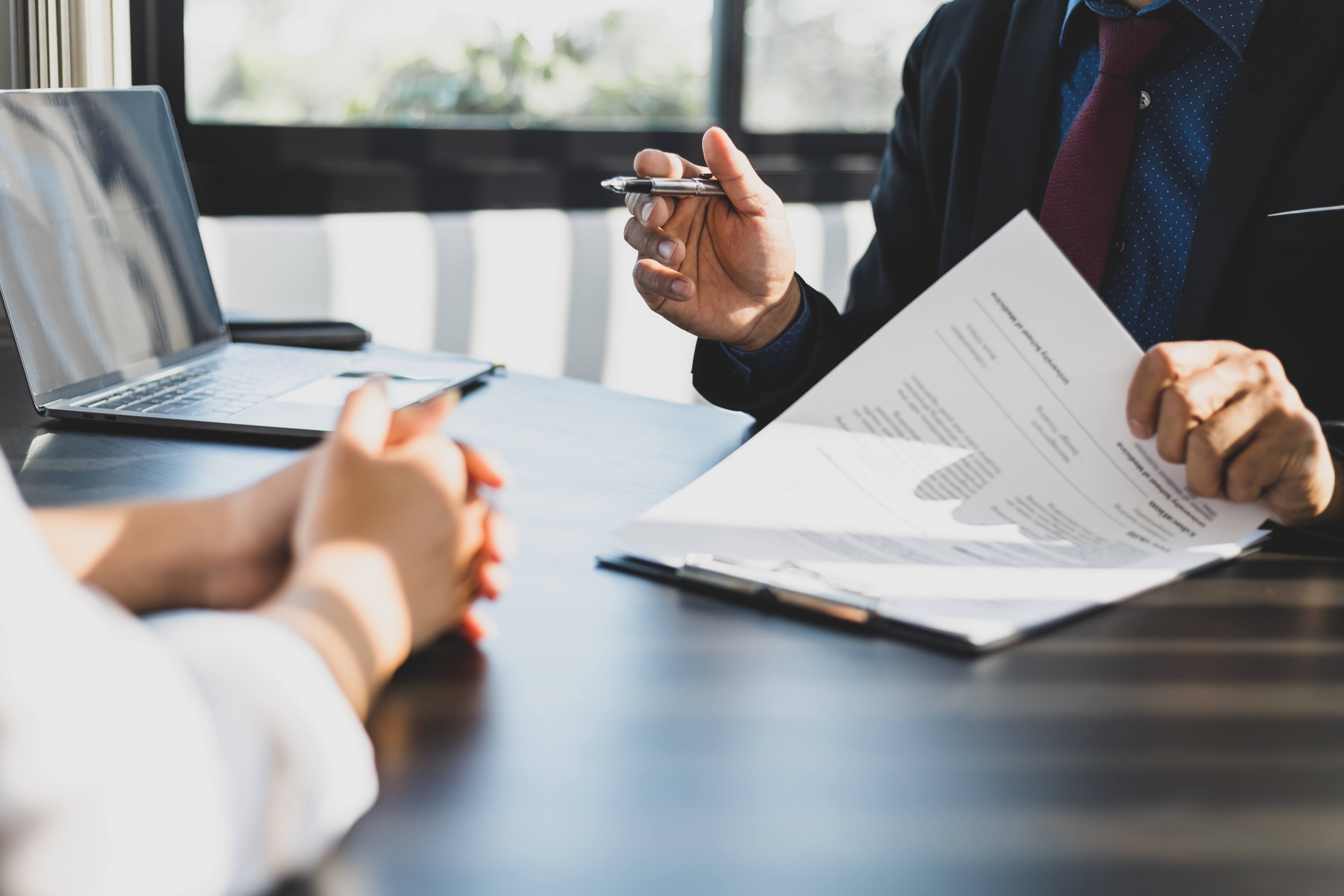 Insurance professionals reviewing documents together